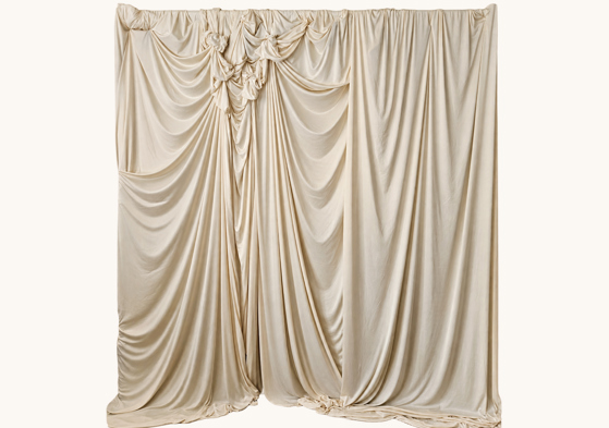 Ivory fabric backdrop with sculptural gathered draping by Nàdair Studio in Edinburgh
